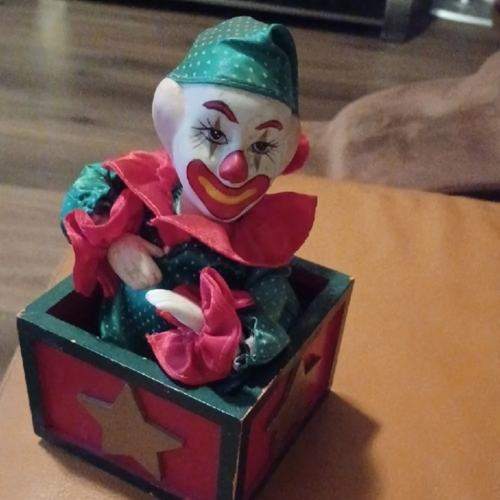 - Vintage Colorful Clown Jack-in-the-Box Toy